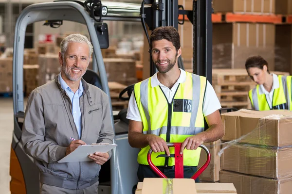 Warehouse manager and workers preparing shipment — Stock Photo, Image