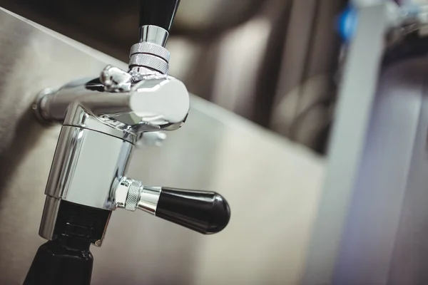 Faucet on machinery at brewery — Stock Photo, Image