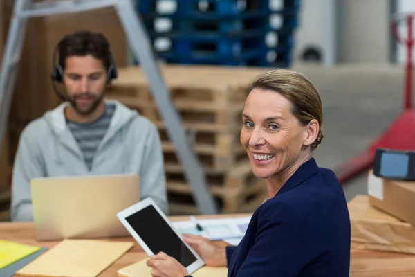 Warehouse manager using digital tablet — Stock Photo, Image