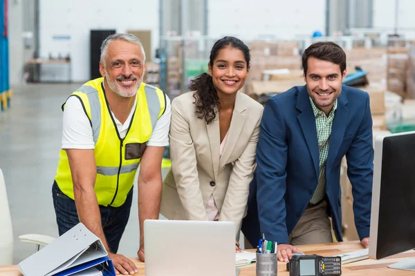 Warehouse managers and worker working together — Stock Photo, Image