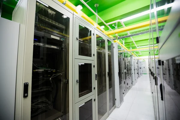 Hallway with row of servers — Stock fotografie