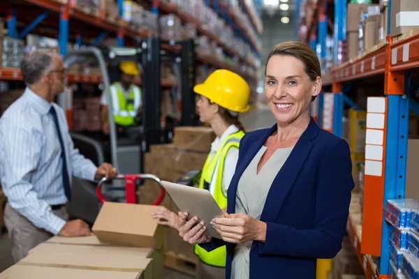 Warehouse manager holding digital tablet — Stock Photo, Image