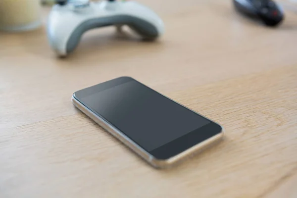 Mobile phone on a table — Stock Photo, Image