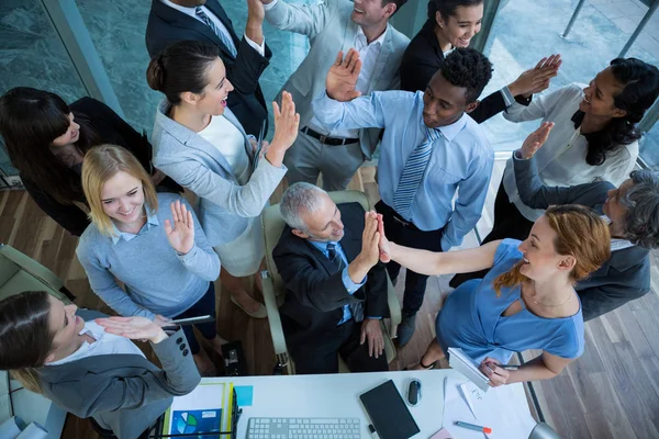 Businesspeople giving high five to each other — Stock Photo, Image