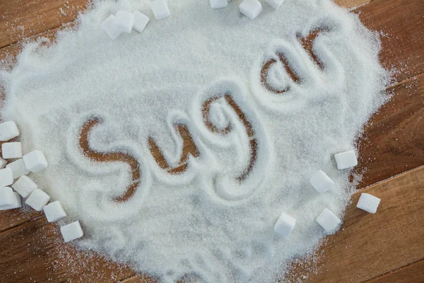 Zucker auf Zuckerpulver geschrieben — Stockfoto