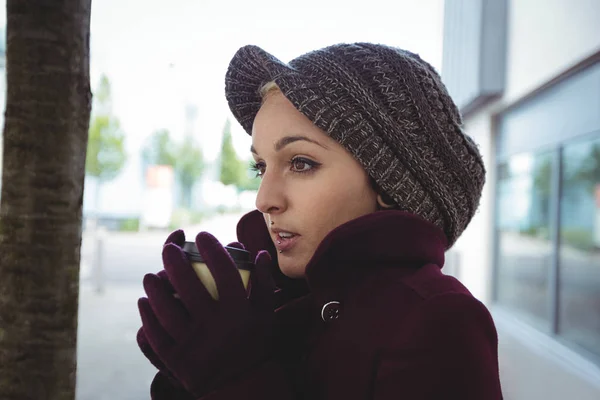 Woman shivering with cold