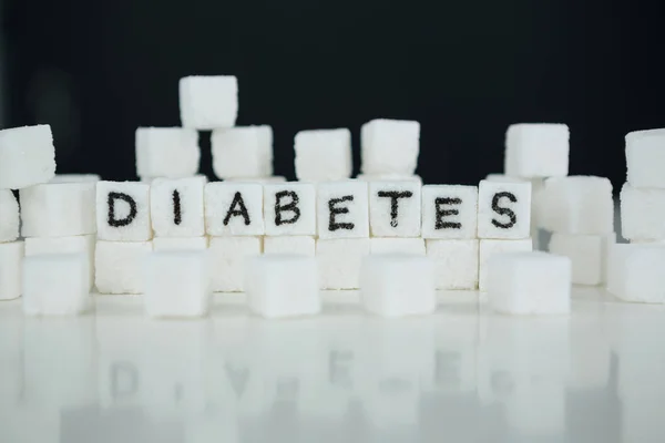 Sugar cubes spelling out diabetes — Stock Photo, Image