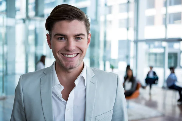 Smiling businessman in office — Stock Photo, Image