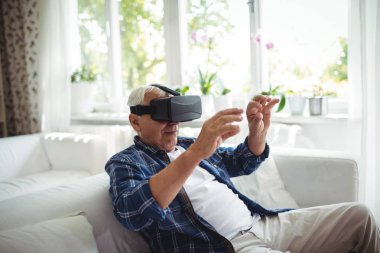 Senior man wearing virtual glasses clipart