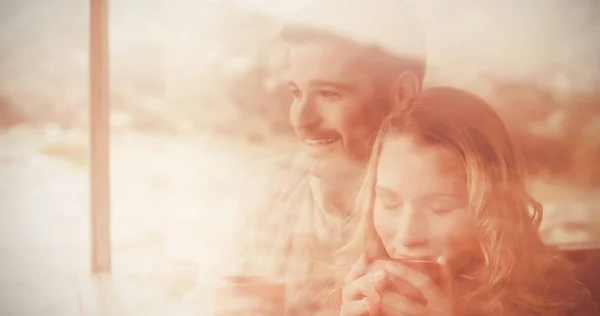 Couple seen through cabin window — Stock Photo, Image