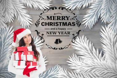 woman in santa hat holding christmas gifts clipart