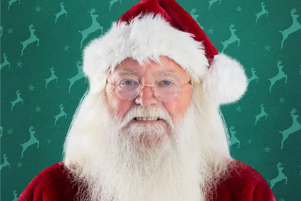 Smiling santa against green background — Stock Photo, Image