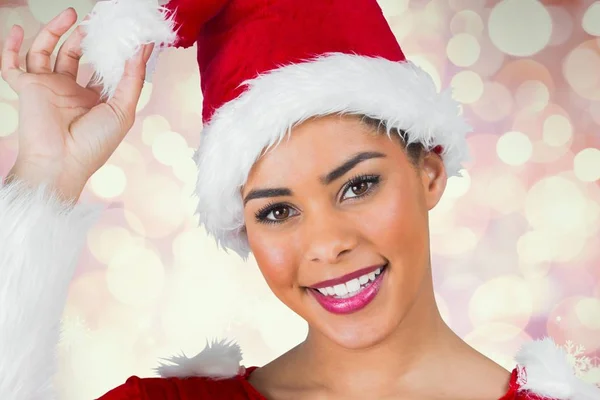 Beautiful woman holding her santa hat — Stock Photo, Image
