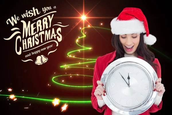 Woman in santa costume holding wall clock — Stock Photo, Image