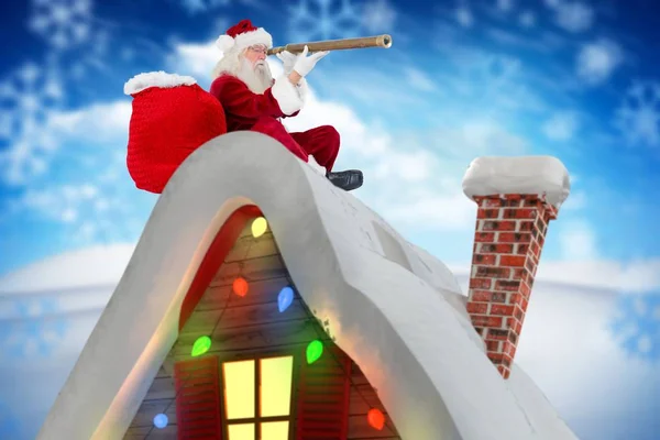 Santa claus tittar genom teleskop — Stockfoto