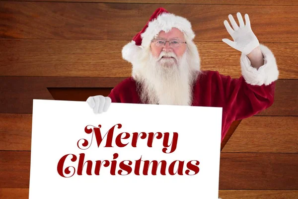 Santa claus drží vánoční pozdrav — Stock fotografie