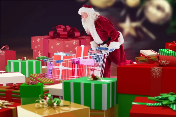 Santa Claus buscando cajas de regalo — Foto de Stock