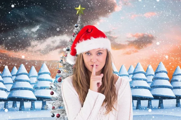 Woman in santa hat with finger on lips — Stock Photo, Image