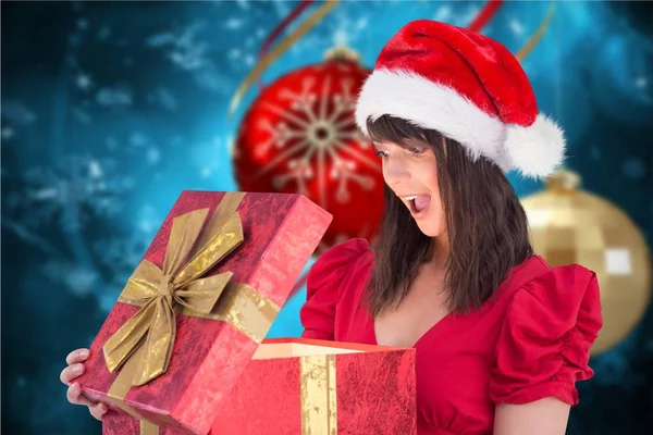 Verrast vrouw in Kerstman hoed — Stockfoto