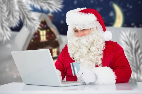 Noel Baba online alışveriş yaparken — Stok fotoğraf