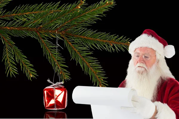 Санта Клаус готовит контрольный список — стоковое фото