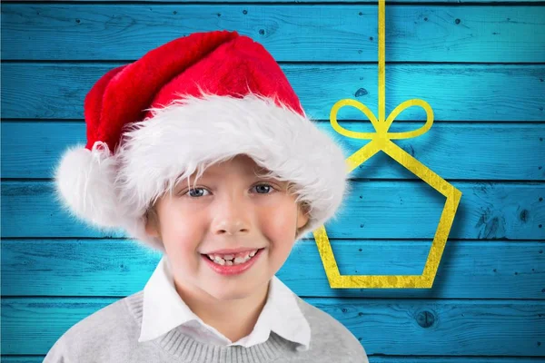 Ragazzo in cappello Babbo Natale sorridente — Foto Stock