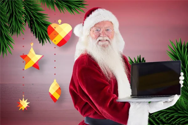 Weihnachtsmann mit Laptop — Stockfoto