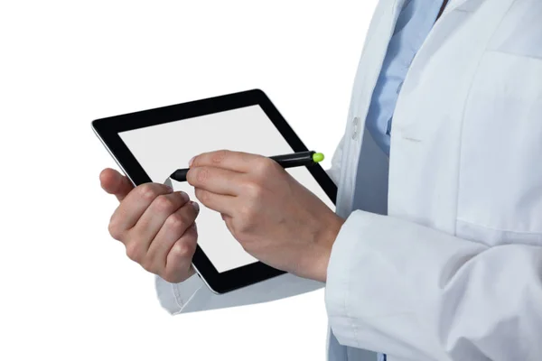 Female doctor using tablet with stylus — Stock Photo, Image