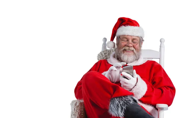 Santa claus met behulp van mobiele telefoon — Stockfoto