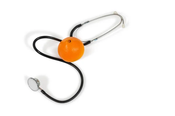 Stethoscope and orange on white — Stock Photo, Image