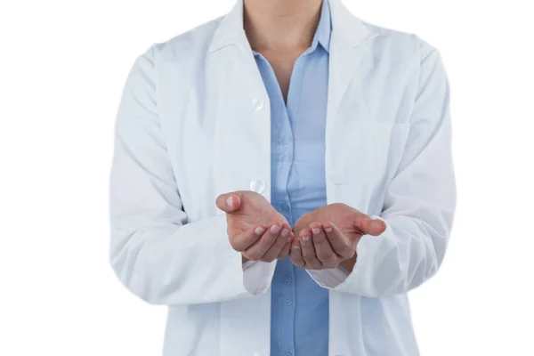 Female doctor standing with hands cupped — Stock Photo, Image