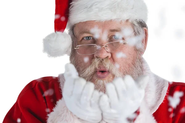 Santa claus blowing fake snow — Stock Photo, Image