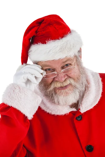 Санта Клаус смотрит сквозь очки — стоковое фото