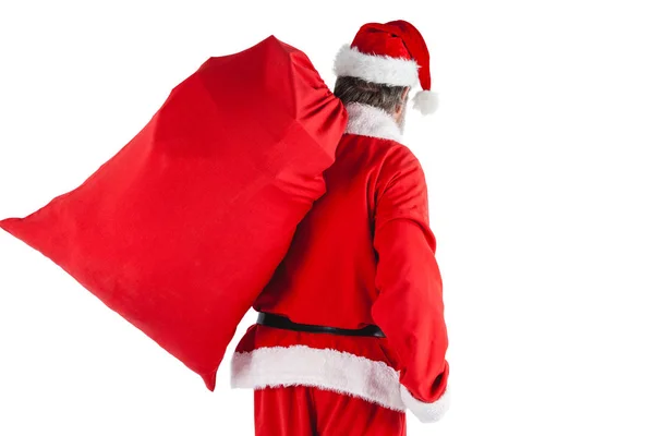 Santa claus draagtas vol geschenken — Stockfoto