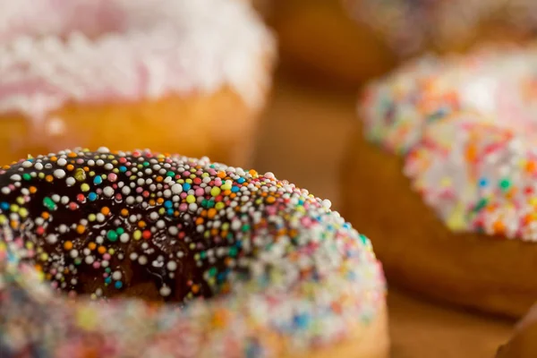 Tasty doughnuts with sprinkles — Stock Photo, Image