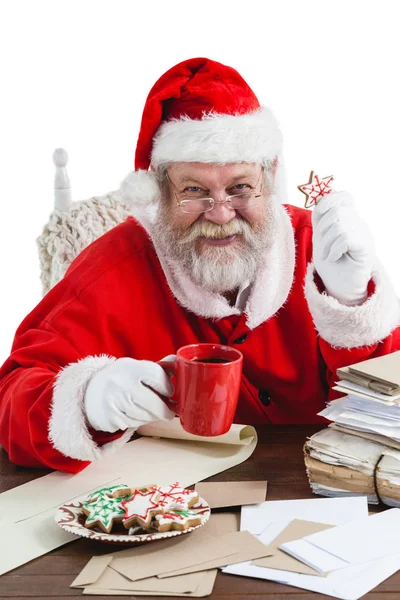 Santa claus holding coffee mug — Stock Photo, Image