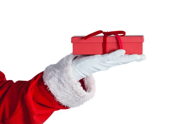 Santa claus holding a gift box in hand — Stock Photo, Image