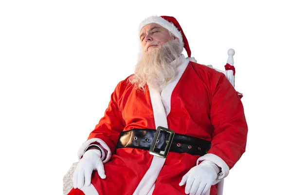 Санта-Клаус расслабляется на стуле — стоковое фото