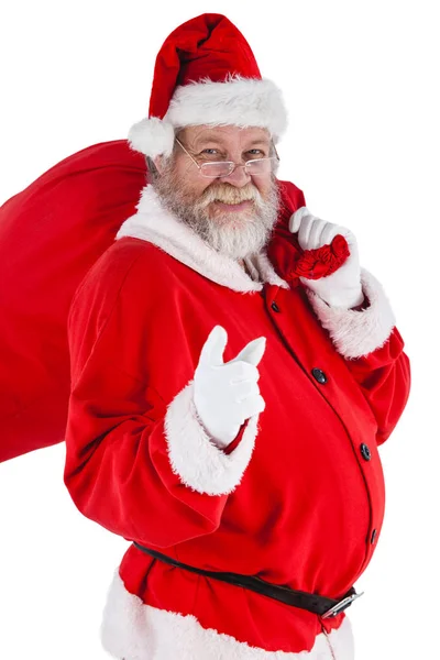 Santa Claus sosteniendo bolsa de Navidad — Foto de Stock