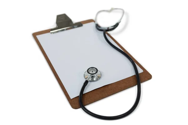 Clipboard with stethoscope on white — Stock Photo, Image