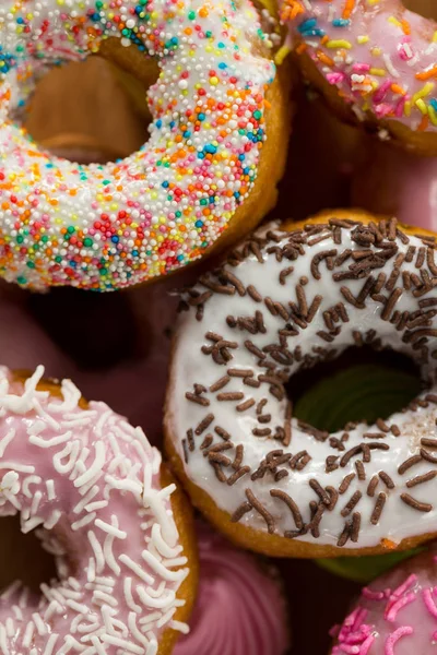 Tasty doughnuts with sprinkles — Stock Photo, Image