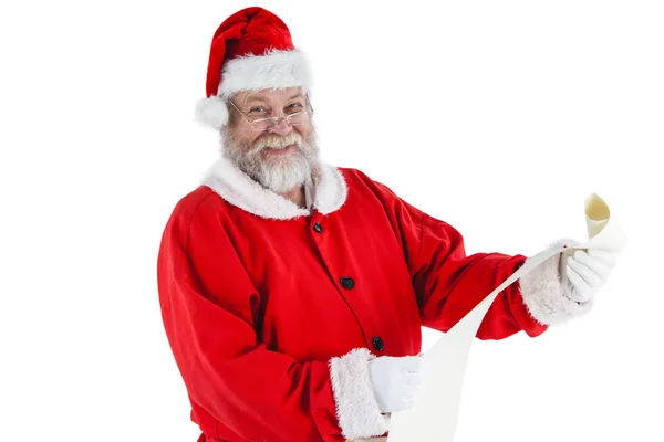 Santa claus sonriendo y sosteniendo el pergamino — Foto de Stock