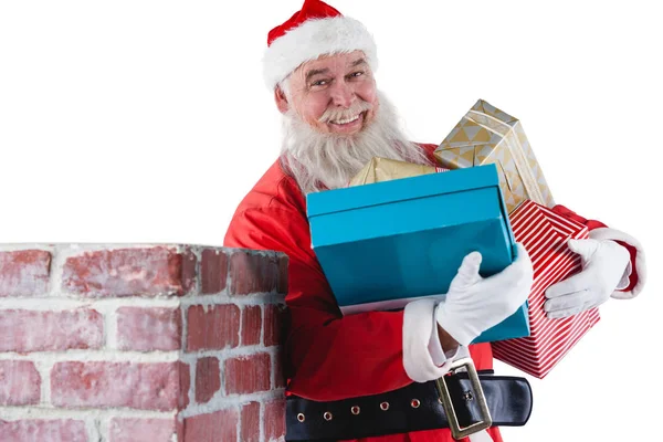 Santa claus uitvoering van diverse geschenken — Stockfoto