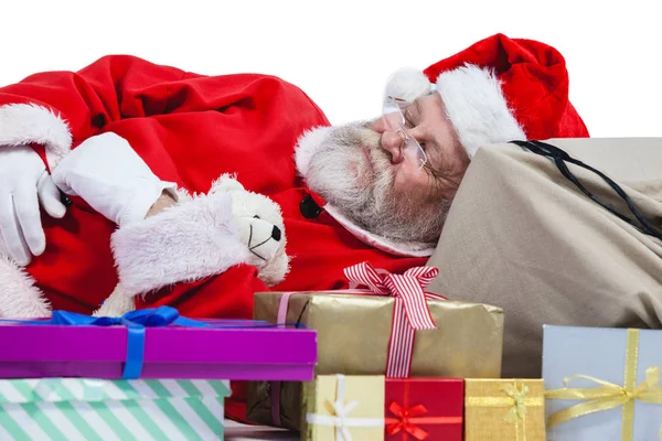 Santa claus sleeping beside christmas present — Stock Photo, Image