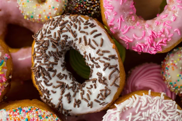 Tasty doughnuts with sprinkles — Stock Photo, Image