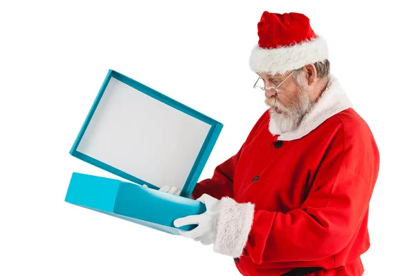 Papai Noel abrir uma caixa de presente — Fotografia de Stock