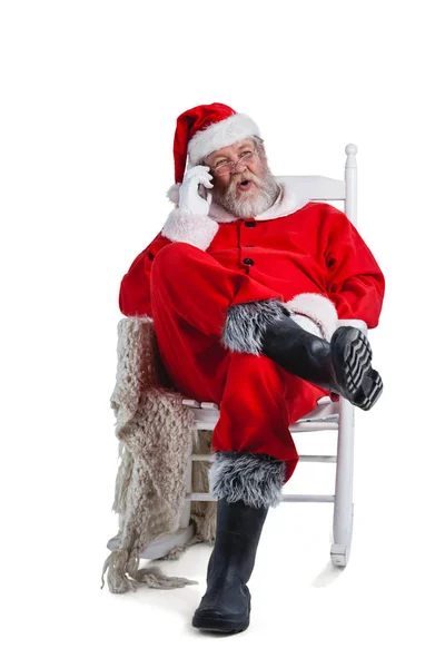 Санта Клаус разговаривает по телефону — стоковое фото