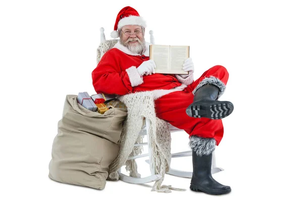 Papai Noel mostrando bíblia — Fotografia de Stock