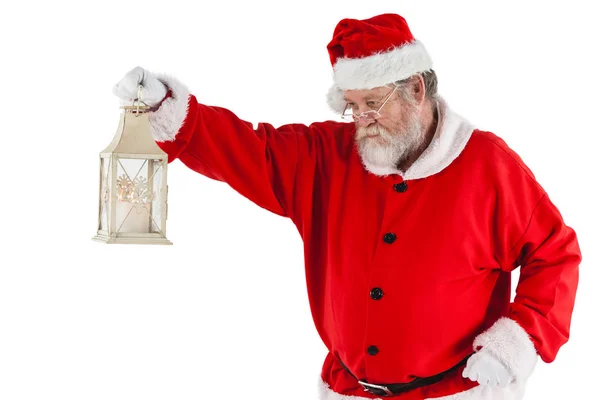 Santa claus holding christmas lantern — Stock Photo, Image