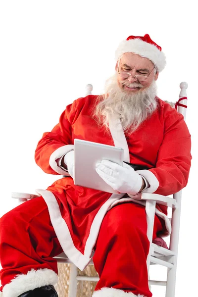 Weihnachtsmann mit digitalem Tablet — Stockfoto